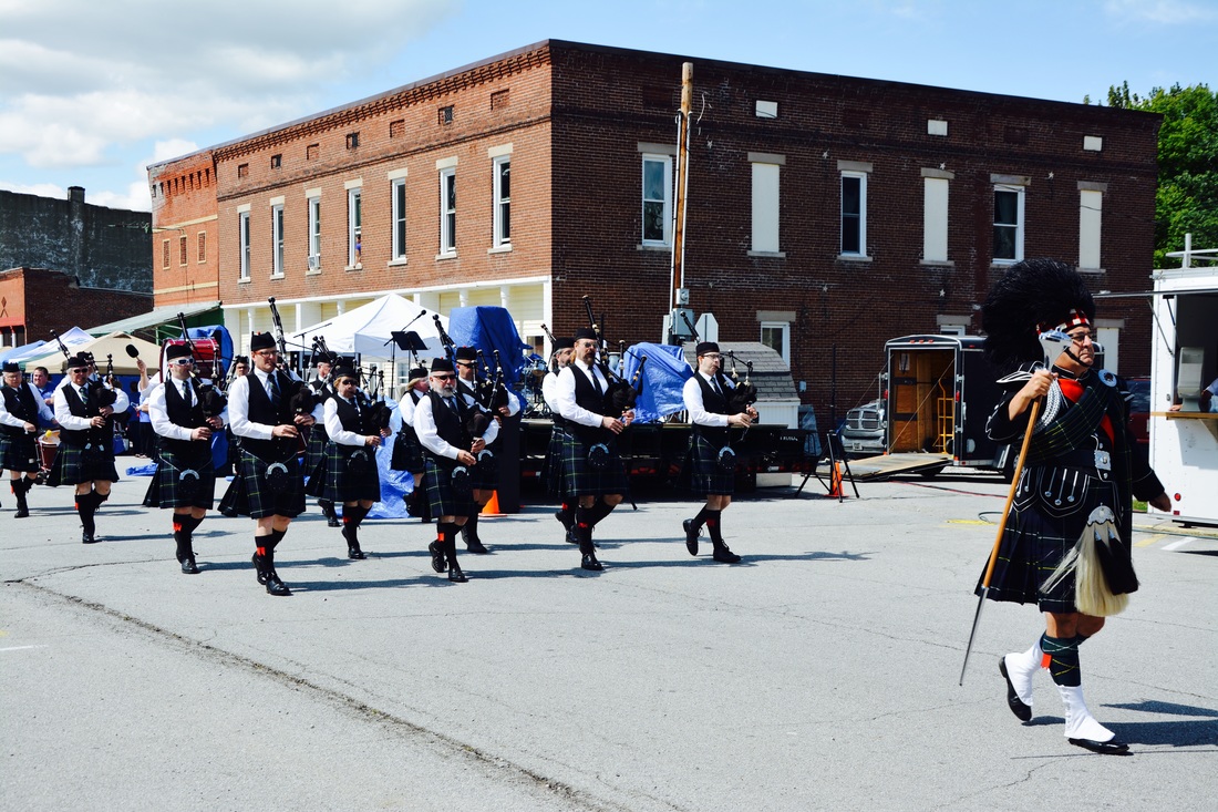 group of people with bag pipes 