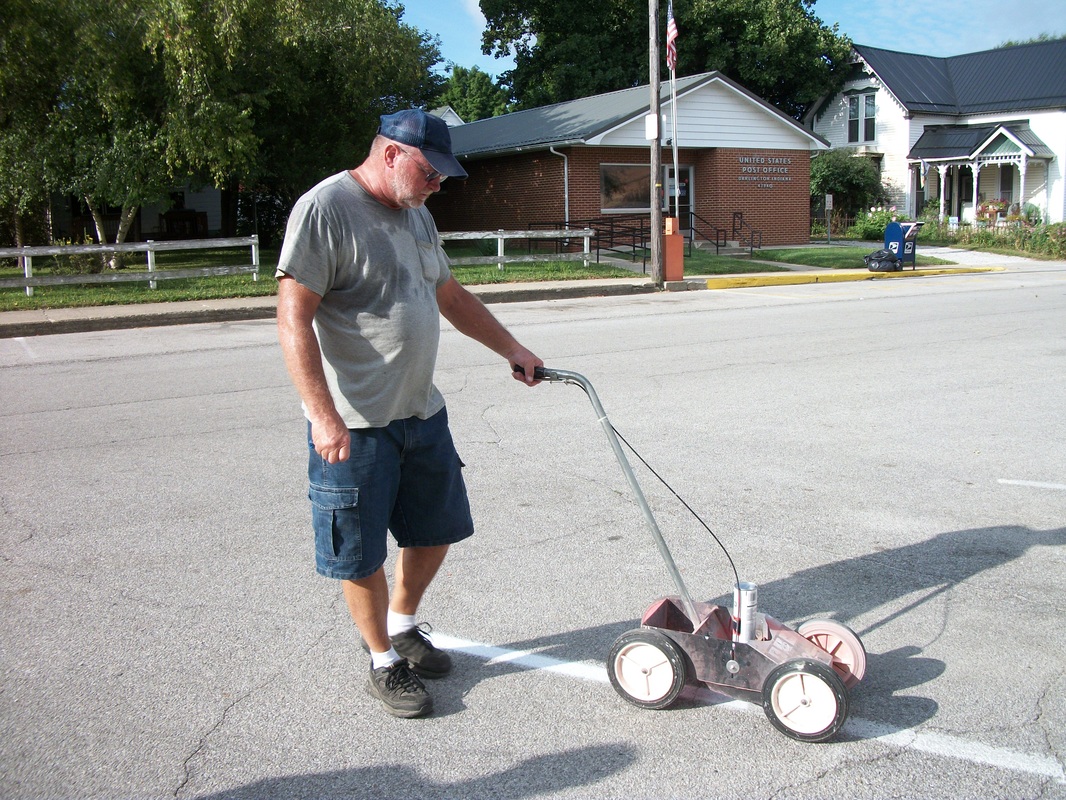 Tim Shoptaw helping to spruce up Main St. by painting parking lines to get ready for the Fish Fry & Festival coming Sept. 9 & 10, 2016.